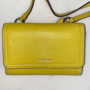 Yellow mini Coach crossbody bag